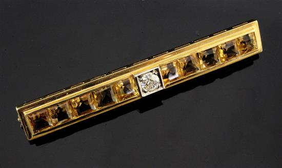 An 18ct gold diamond and citrine bar brooch, 2.25in.